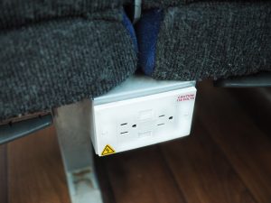 Electrical outlet on the bus for plugging in accessories during your trip